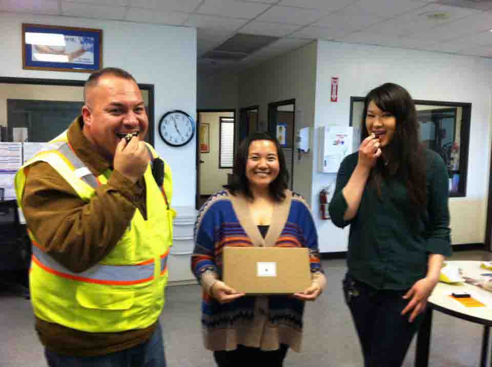 warehouse managers enjoying with chocolate snack