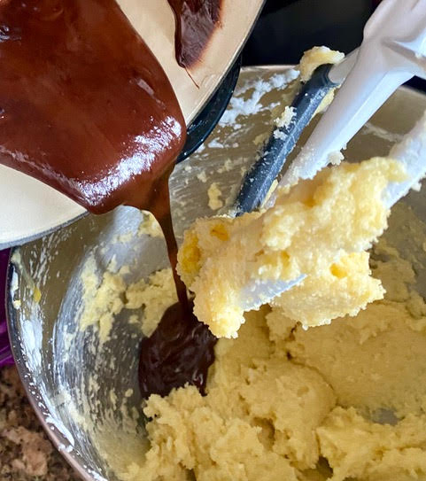 mixing in chocolate into cake